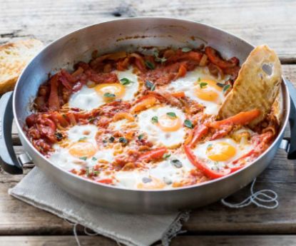 Huevos Rancheros breakfast cooking in the Cobb fry dish