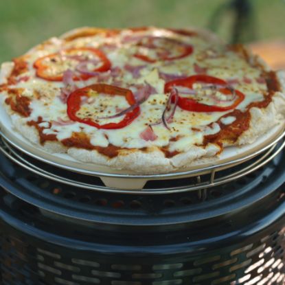 margarita pizza cooking on the Cobb Pizza Stone